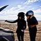 Under the hood: Mei and White check the oil in their 2023 Kia Sportage X-Pro. Shown with optional features. Not for sale.
